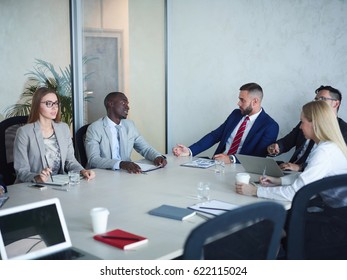 CEO Board Of Directors Meeting In Conference Room: Multi Ethnic Group Of Business People Discussing Corporate Issues, African-American Man Among Them