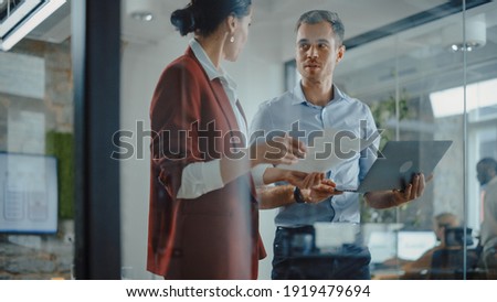 CEO and Chief Executive Talking About Company Business Growth, Consult Data Analysis and Use Laptop Computer. Two Professionals Discussing Revenue Increase, Market Disruption, Planning Strategy