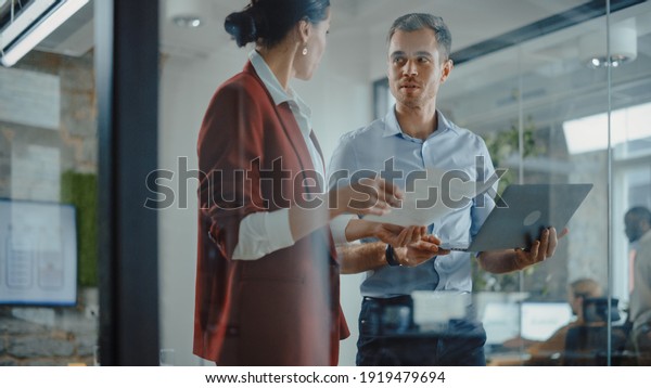 CEO and Chief Executive Talking About Company\
Business Growth, Consult Data Analysis and Use Laptop Computer. Two\
Professionals Discussing Revenue Increase, Market Disruption,\
Planning Strategy