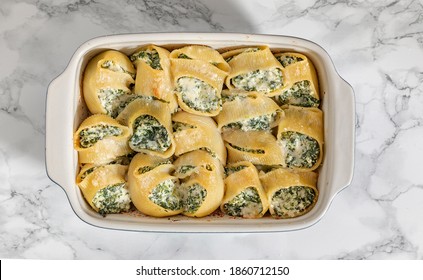 Ceramic Baking Tray With Pasta Lumaconi Stuffed With Ricotta Cheese And Spinach.