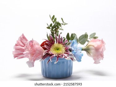 Ceramic bowl with flowers isolated on white background