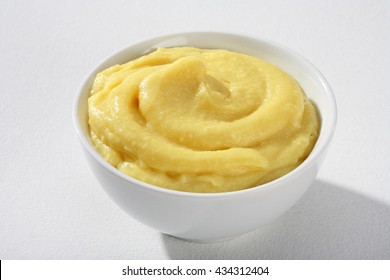 Ceramic bowl of mashed potato puree on white background. Close up, high resolution product.