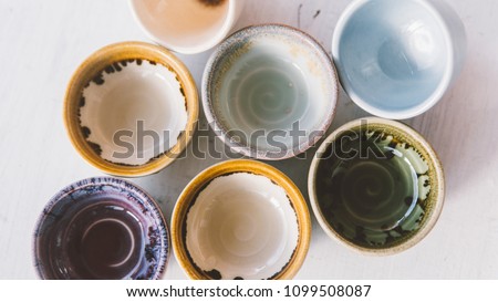 ceramic bowls for drinks close-up.  Ceramic ware made by own hands