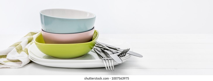 Ceramic bowls with silver cutlery