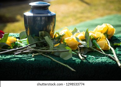 Ceramic Burial Urn With Yellow Roses, In A Morning Funeral Scene, With Space For Text On The Right