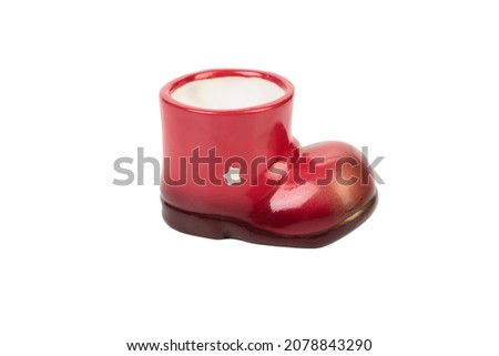 Ceramic Christmas boot for gifts. Isolated over white background. Close-up.