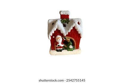 A ceramic Christmas house decoration. It's a small, red house with a snowy roof and a chimney. Santa Claus is depicted on the side, ringing a bell. - Powered by Shutterstock