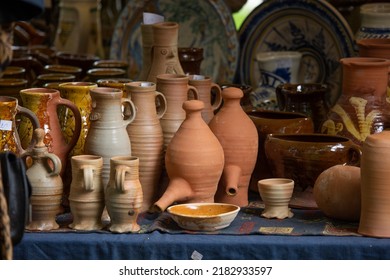 Ceramic clay terracotta jug, pot, vase, kitchen souvenirs on shelf at street handicraft pottery shop. Old earthen terracotta jug, pot, clay jar pattern in store. Clay brown various ceramic pot  jugs - Shutterstock ID 2182933597