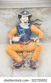 Ceramic cowboy statue at Wat Pariwat, Bangkok