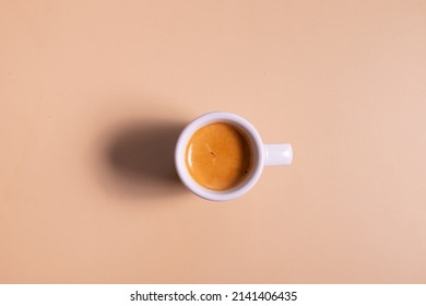 Ceramic cup of coffee on a colored background. Minimalist monochrome concept.