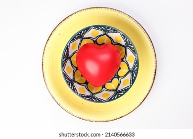 Ceramic Decorated Food Bowl Yellow Plate With Three Dimension 3d Red Hart Symbol Inside On White Background Copy Text Space Top View