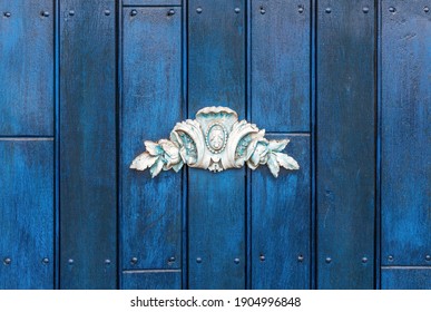 Ceramic decoration on blue door, Quito, Ecuador.