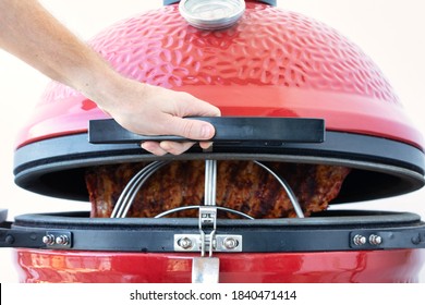 Ceramic Egg Smoker. Red Bbq Close Up.white Background. Backyard Grilling.