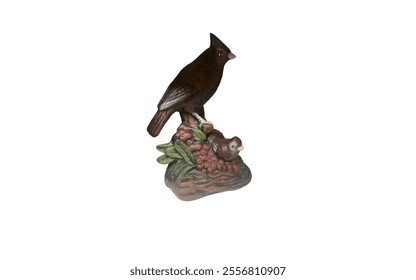 A ceramic figurine of a cardinal bird perched on a branch with berries. The bird is painted in realistic colors, with a bright red body and black mask.  - Powered by Shutterstock