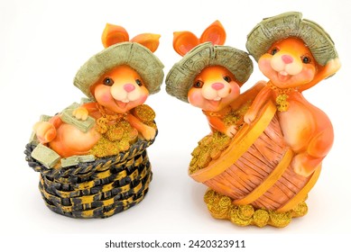 ceramic figurines of three Easter bunnies close-up on a white background