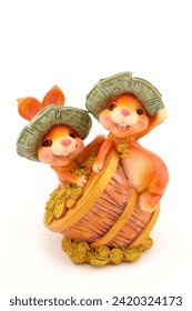 ceramic figurines of two Easter bunnies for table decoration close-up on a white background