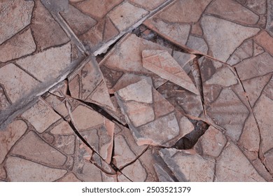 The ceramic floor of the garage is damaged and imprecise