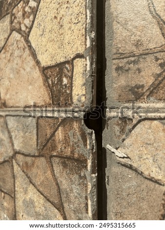 The ceramic floor of the garage is damaged and imprecise