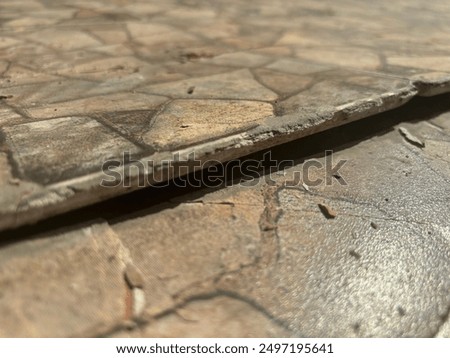 The ceramic floor of the garage is damaged and imprecise