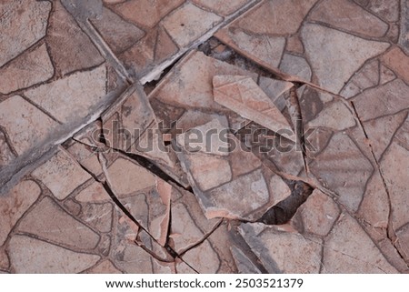 The ceramic floor of the garage is damaged and imprecise