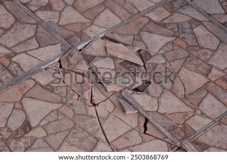 The ceramic floor of the garage is damaged and imprecise