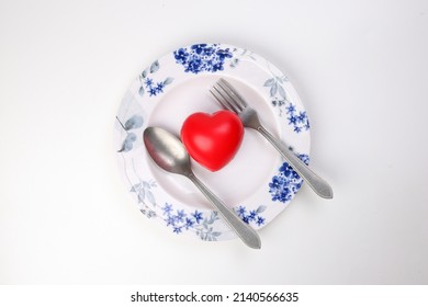 Ceramic Retro Flower Decorated White Food Plate Fork Spoon With Three Dimension 3d Red Hart Symbol On Top Of It White Background Copy Text Space Top View