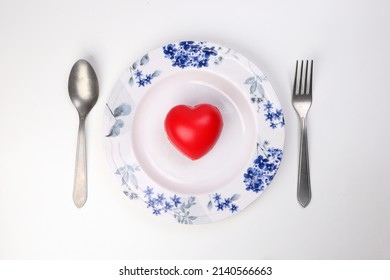 Ceramic Retro Flower Decorated White Food Plate Fork Spoon With Three Dimension 3d Red Hart Symbol On Top Of It White Background Copy Text Space Top View