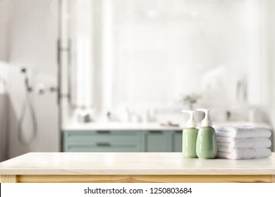 Ceramic shampoo, soap bottle and towels on counter over bathroom background. table top and copy space - Shutterstock ID 1250803684