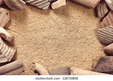 Ceramic shards frame archaeological background