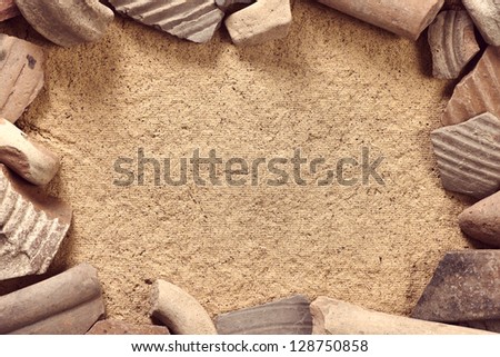 Ceramic shards frame archaeological background