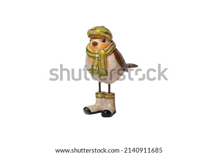 Ceramic sparrow in clothes on a white isolated background.