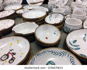 Ceramic tableware top view on wood background. Antique vintage multicolored empty plate on old wooden table. Hand-painted plate. Flower drawing on ceramics - Powered by Shutterstock - Get 15% off with code: PIKWIZARD15