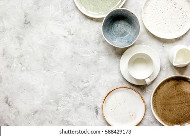 ceramic tableware top view on stone background mock up