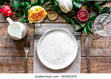ceramic tableware top view on wooden background mock up