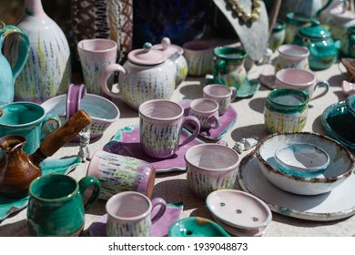 ceramic tableware,tea-set, handmade fair, purple porcelain teapot, cups, clay beads, hand painted, natural materials, floral design, porcelain decorations, jugs, vessels, clay pot - Powered by Shutterstock