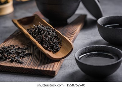 Ceramic Tea Pot And Cups With The Famous Photo In The Room Chinese Tea Ceremony On Dark Background.