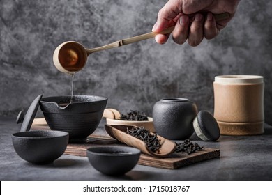 Ceramic Tea Pot And Cups With The Famous Photo In The Room Chinese Tea Ceremony On Dark Background.