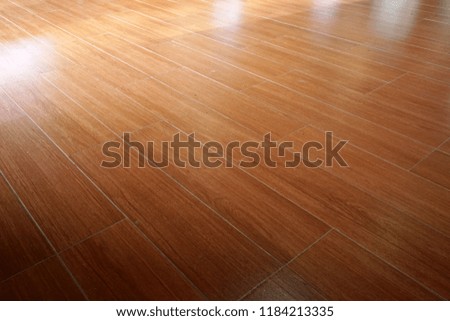    Ceramic tile floor with light reflection                           