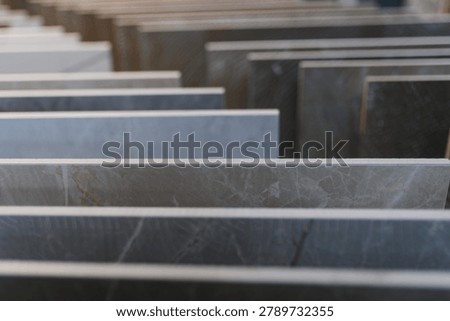 Ceramic tile samples arranged for viewing, offering a range of material finishes and colors for home renovation and interior design projects