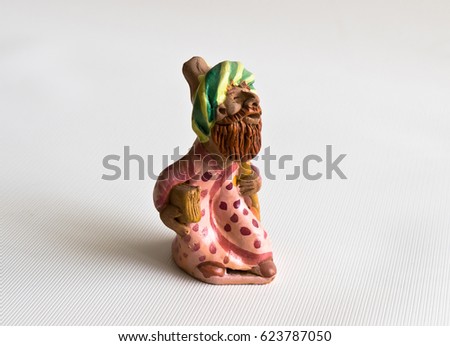 Ceramic toy Uzbek on a white background