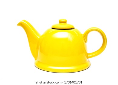 Ceramic yellow teapot on a white background. Isolate. Place for an inscription. Vintage teapot.Tea infuser.Kitchen utensils.Yellow color. Bright photo. Pottery Kettle. Copy space. Tea ceremony