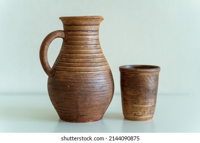      Ceramics, a ceramic product made with your own hands, made on a potter's wheel, a jug, a mug, clay.  - Shutterstock ID 2144090875