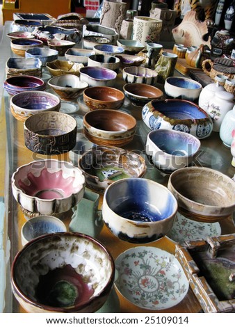 Similar – many part colorful tin buckets at the flea market