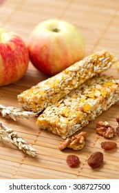 Cereal bars of granola with apples, nuts and raisins