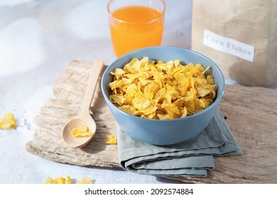 Cereal bowl for breakfast. Cornflakes with orange juice.ready to eat healthy breakfast - Powered by Shutterstock