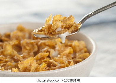 Cereal bowl and spoon with milk - Shutterstock ID 138398198