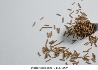 Cereal bran stick in spoon on white background - Powered by Shutterstock