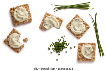 Cereal Crackers With Cream Cheese And Cyboulette On White Background From Top View