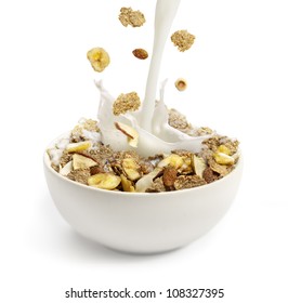 Cereal And Milk Pouring Into A White Bowl