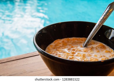 Cereals with milk at the swimming pool - Powered by Shutterstock